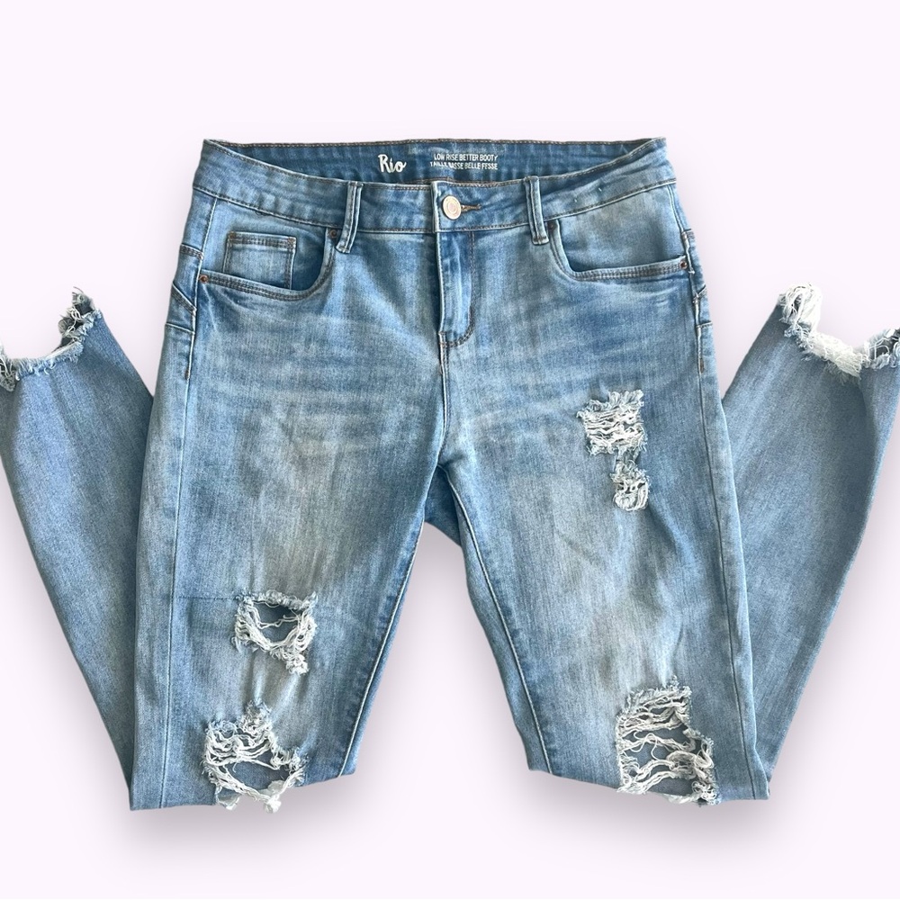 Distressed Light Blue Stretch Denim Jeans.